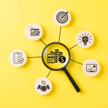 Financial planning icons connected with magnifying glass focus.