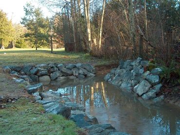 A rip rap lined waterway to prevent land loss at high water.