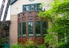 Featuring landscaping and foliage, the property no longer looks like a center city domicile.