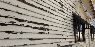 Weatherboard home during painting preparation