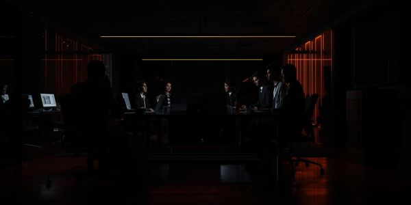 Group of people round a desk