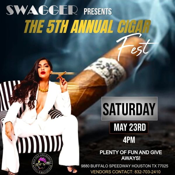 Woman in white suit smoking a cigar at the 5th Annual Cigar Fest event.