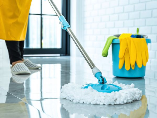 A person mopping the floors