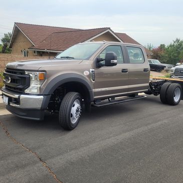COMING SOON:  2023 Ford F550 4WD Diesel  WITH 12' Studio Stake bed and lift gate. 6 passenger