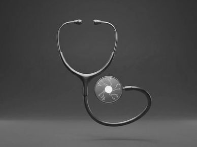 A stethoscope with a heart-shaped diaphragm against a dark background.