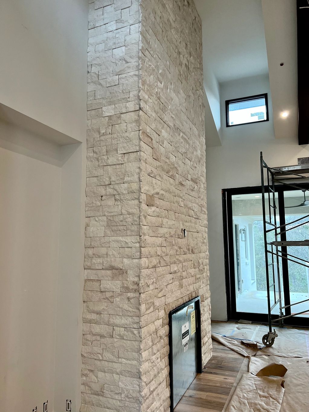 A long size chimney with silver gates inside a house