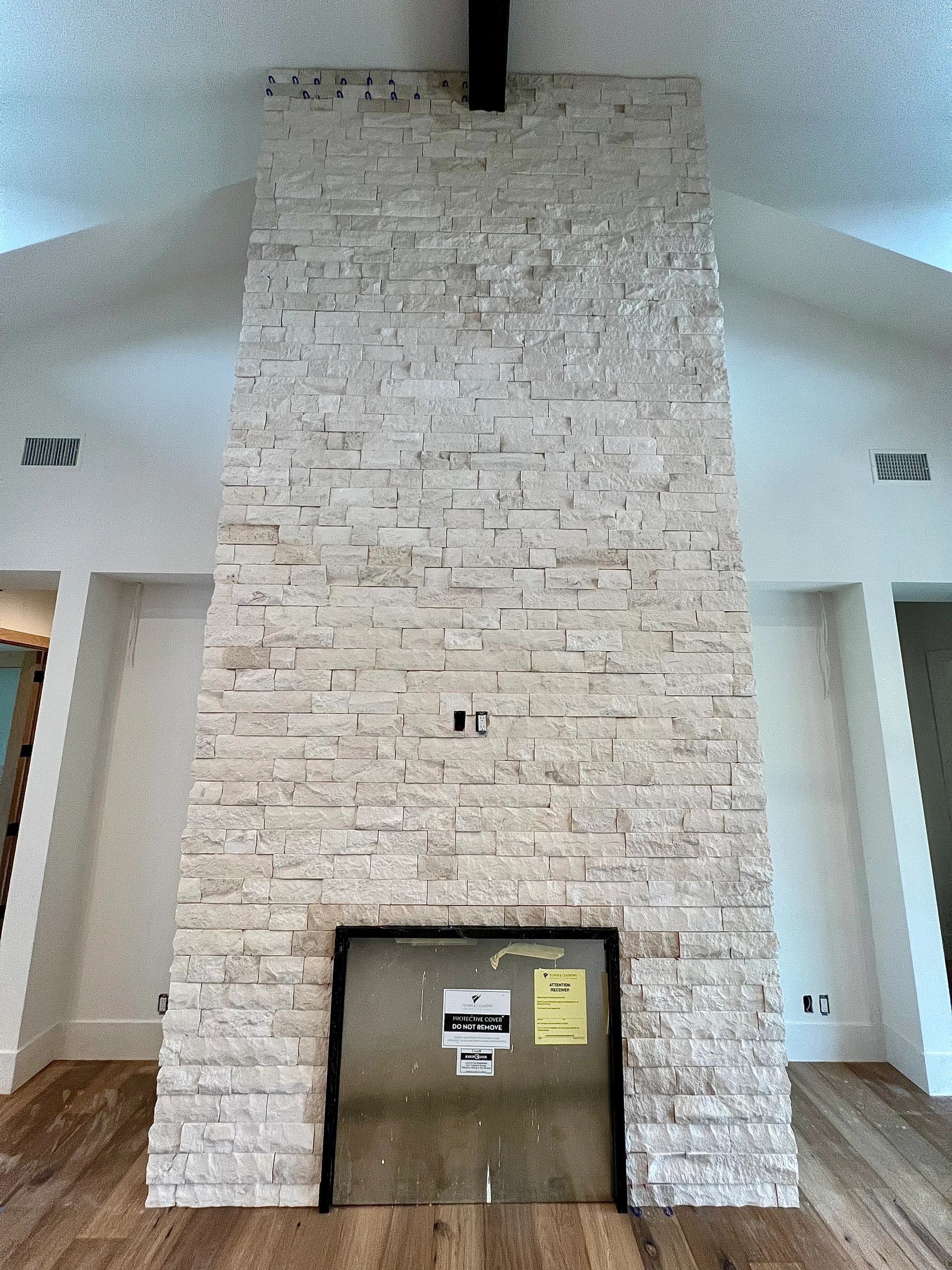A long size chimney with silver gates inside the house