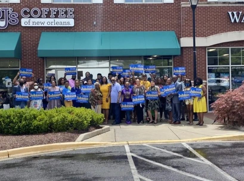 Sylvia Johnson for State Senate Maryland District 23 candidate standing outside PJ's Coffee shop.