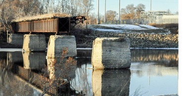 Destroyed railroad bridge that will be replaced as part of ConnectCR's projects.