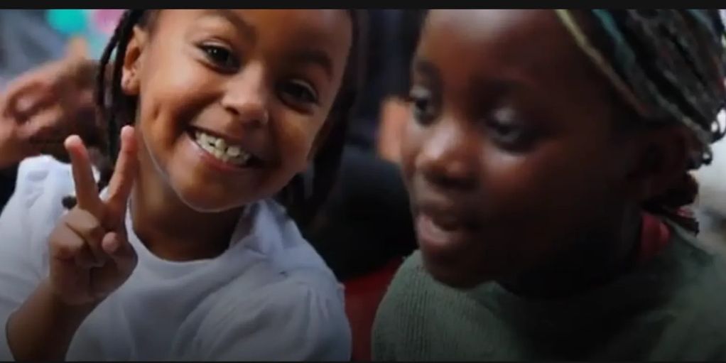 Student giving a peace sign to the camera. 