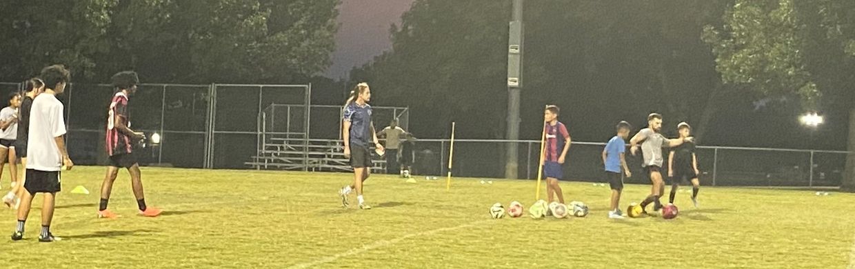 Coach ben and Coach Max leading a group session for high schoolers