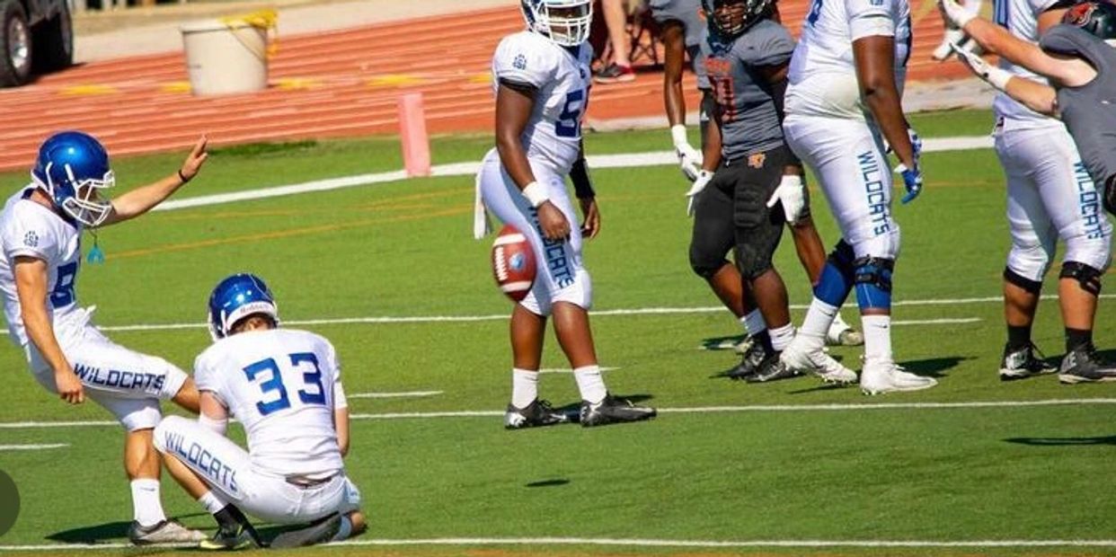 Coach Ben kicking for Culver Stockton College