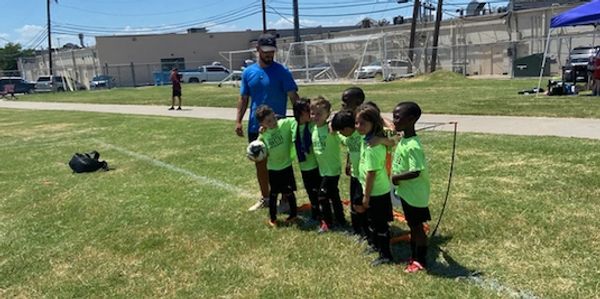 Coach Ben's 2018 boys team after winning a game in a local tournament