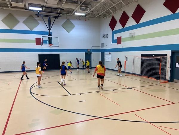 Yellow team verses blue team, coach ben as goalie/ monitoring game play
