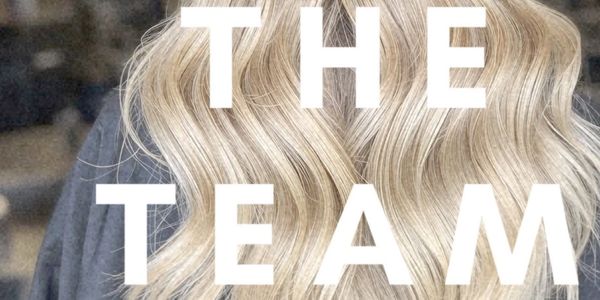 Blonde wavy hair with 'THE TEAM' text overlay.