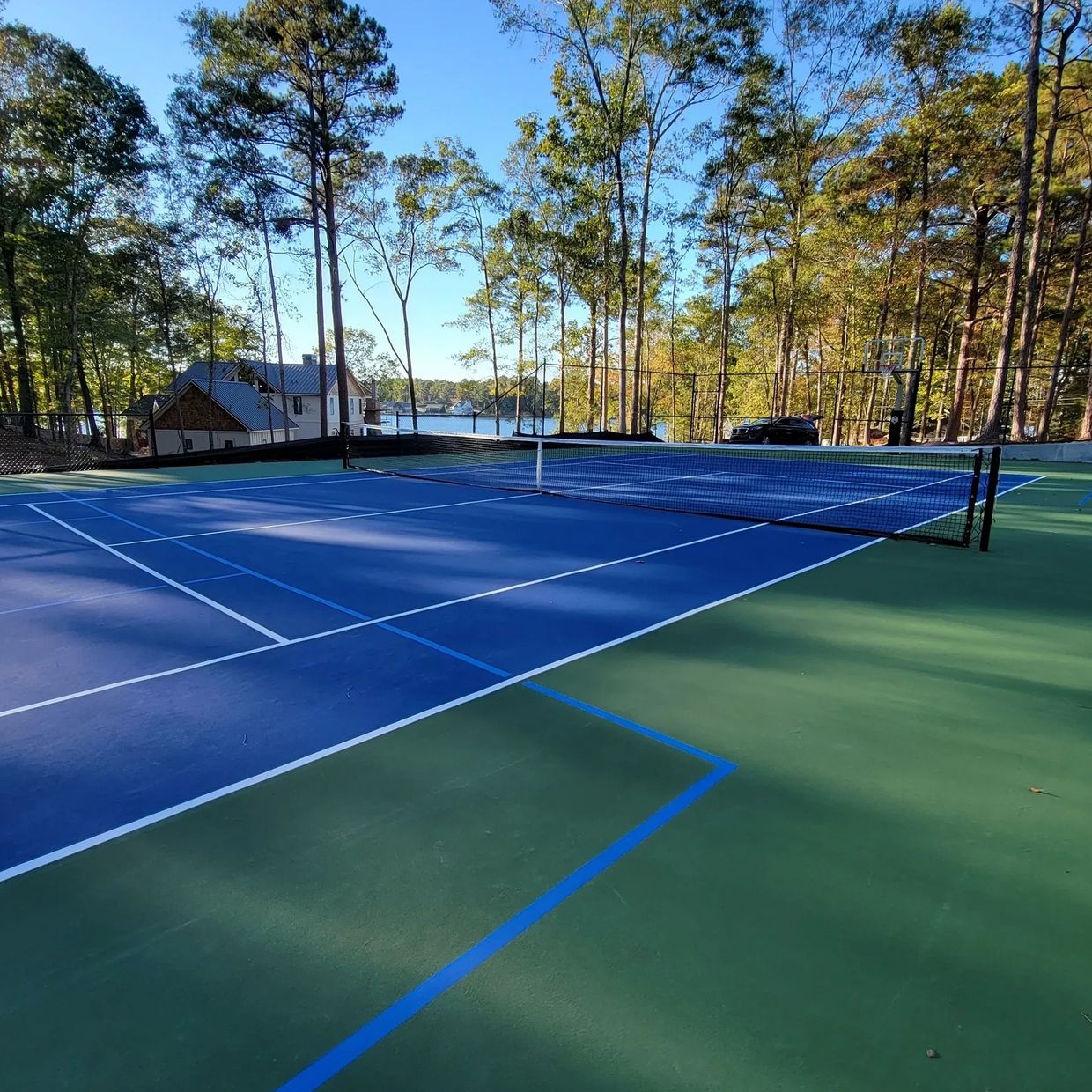 New Construction Cushion X Concrete Tennis and Pickleball court with Dominator Basketball goal.