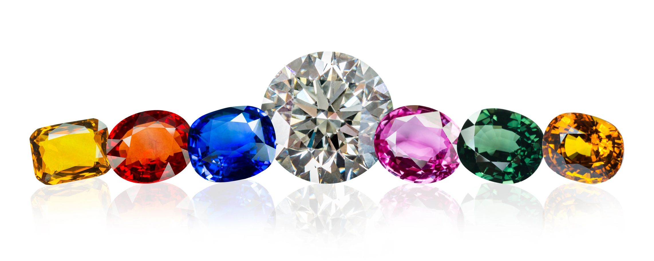 Gemstones lined next to each other with a large diamond in the center