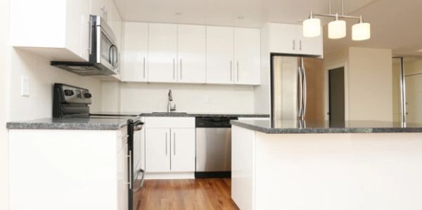 Kitchen with white cabinets and blue pearl granite counters