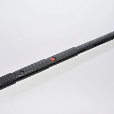 telescoping pole in shown in locked position with red button engaged