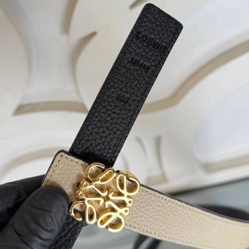 Close-up of a Loewe leather belt with a gold buckle.