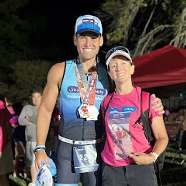 After Swimming Event taking Man and woman a picture on the camera