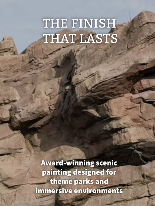 Rocky terrain with text about scenic painting for theme parks.