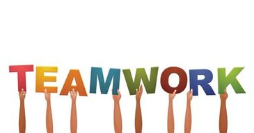 Hands hold up letters spelling 'TEAMWORK'.