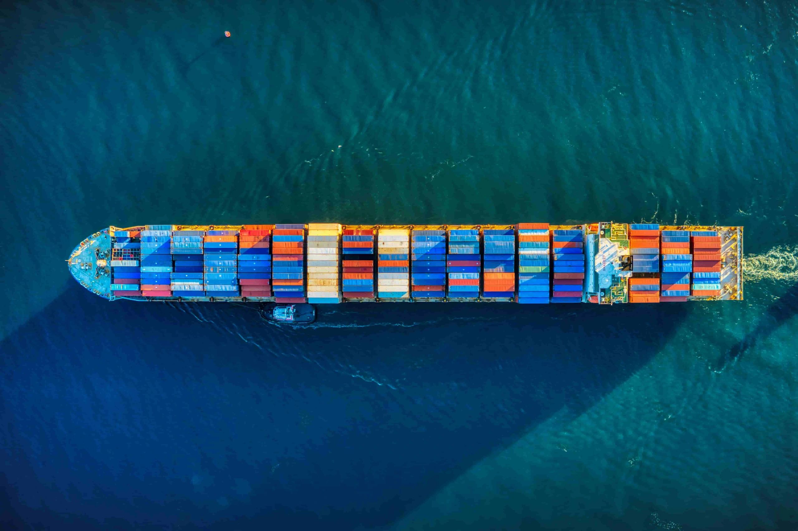  view of a loaded cargo container ship underway, optimized by AnchorOS ship management software