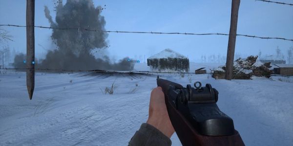 First-person view of a gun in snowy battlefield with explosion.