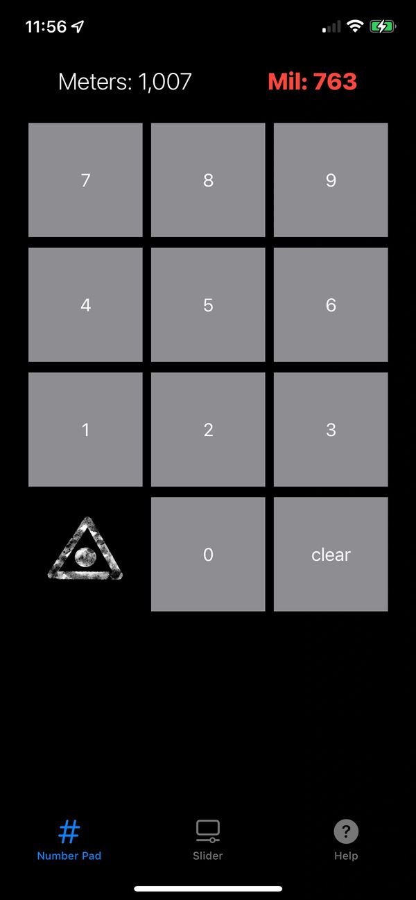 Mobile app screen with a numeric keypad and distance conversion.