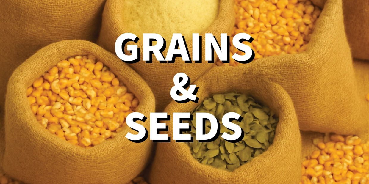 Various grains and seeds neatly packed in burlap sacks.