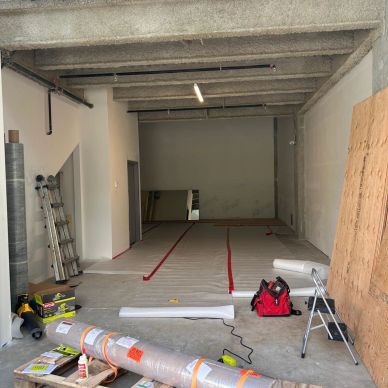 Empty room with renovation materials and tools.