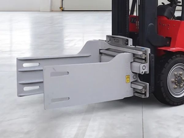 Forklift attachment with clamp mechanism.
