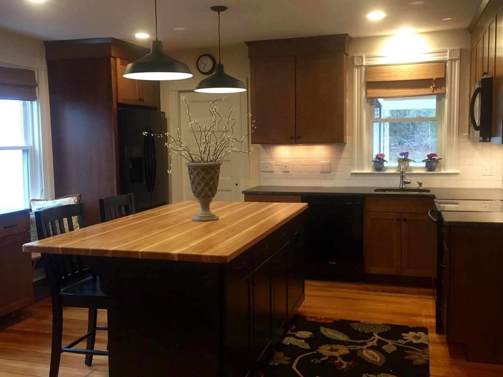 Kitchen remodel farmhouse kitchen Plainville MA island black cabinetry wood floor kitchen farm house