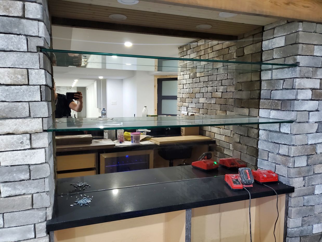Bronze tinted mirror, and glass shelves for bar