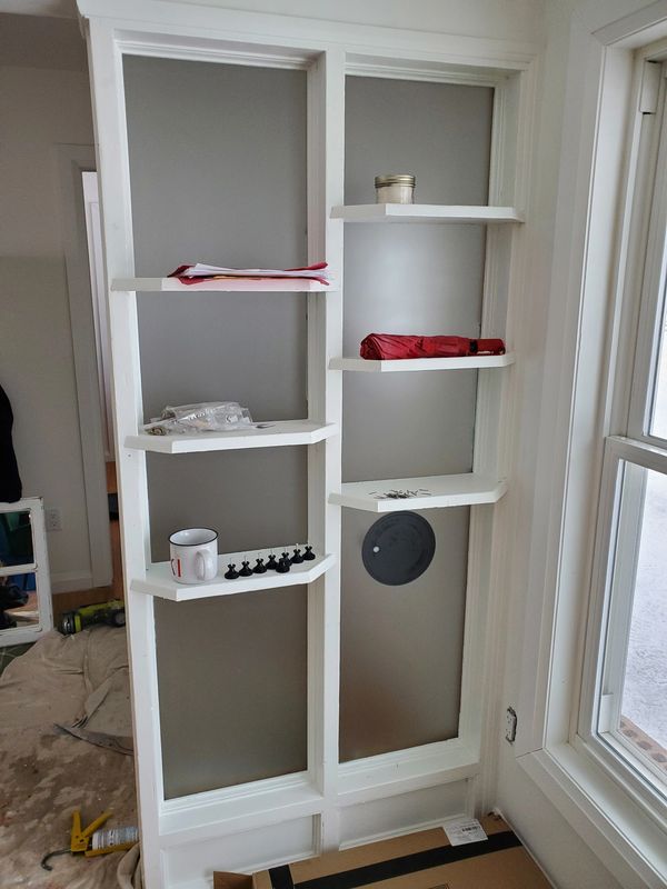 Custom frosted panel behind shelving
