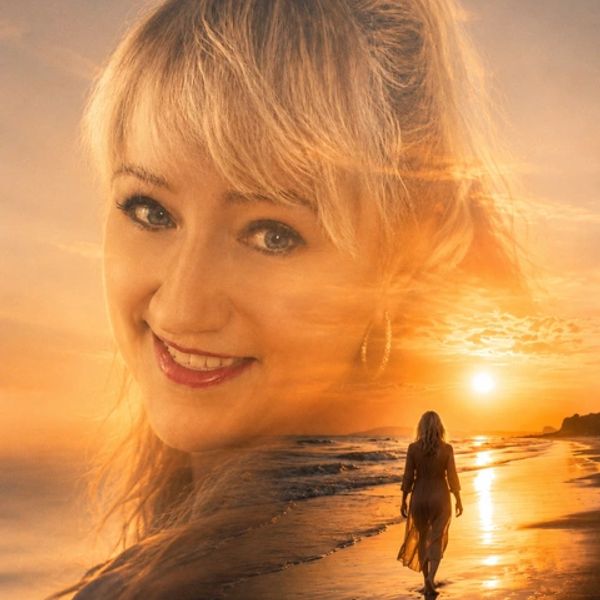 Double exposure of a smiling woman and a beach sunset.