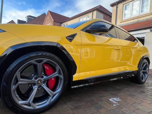 A clean and detailed yellow Lamborghini car
