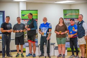 Para team members pose for a picture as they accept their medals. 