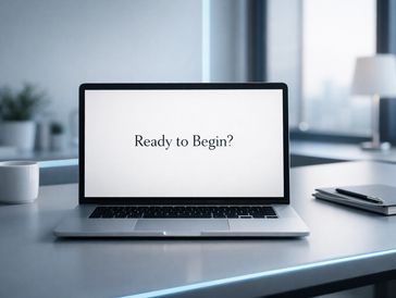A laptop on a desk displaying 'Ready to Begin?' on the screen.