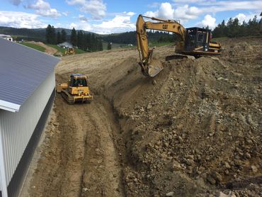 residential excavation - site prep on grade with trackhoe and dozer