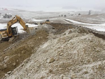 residential excavation - off-season site prep with trackhoe and dozer