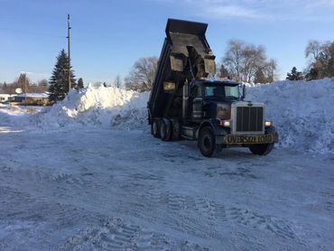 commercial excavation - snow hauling with dump truck