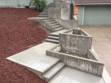 concrete steps with planters