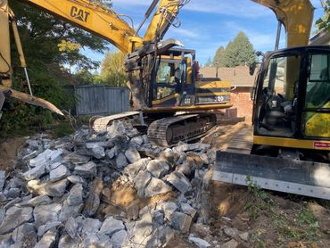 residential excavation - trackhoe demolition site prep for pool (view 1)