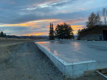 residential flatwork - shop (view 4) - power trowel smooth finish slab completed