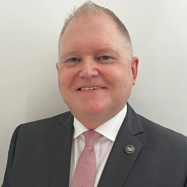 Cheshire Celebrant in grey suit smiling man