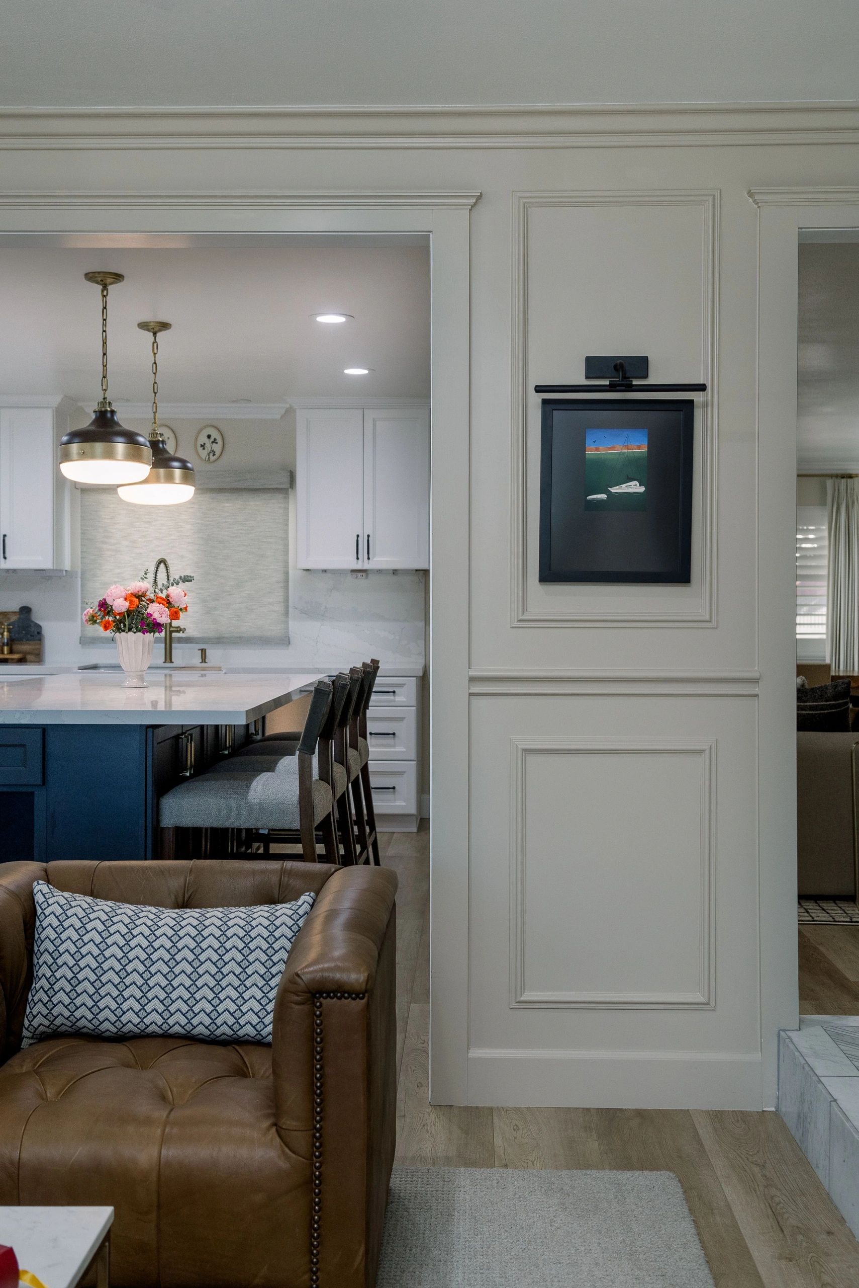 Half view of kitchen island and seating area. 