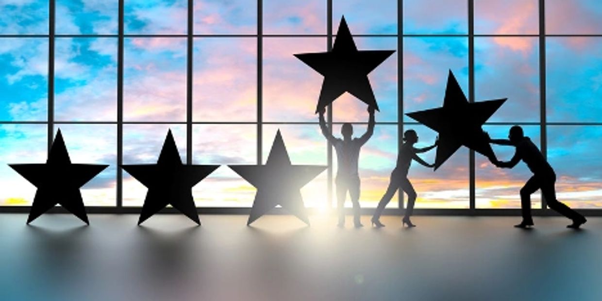 people holding up stars in a row of  five