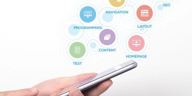person holding cell phone and round icons above it
